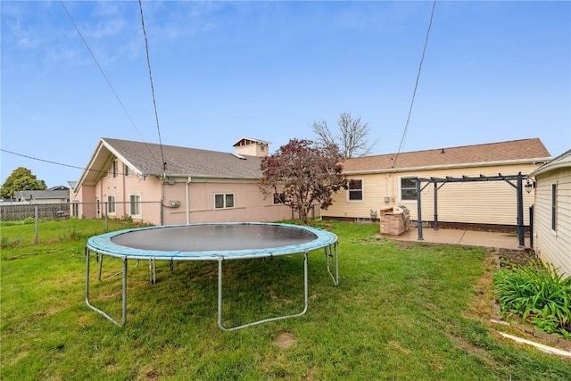 5315 E Ave NW, Cedar Rapids, IA 52405 - back of house featuring a trampoline and a pergola