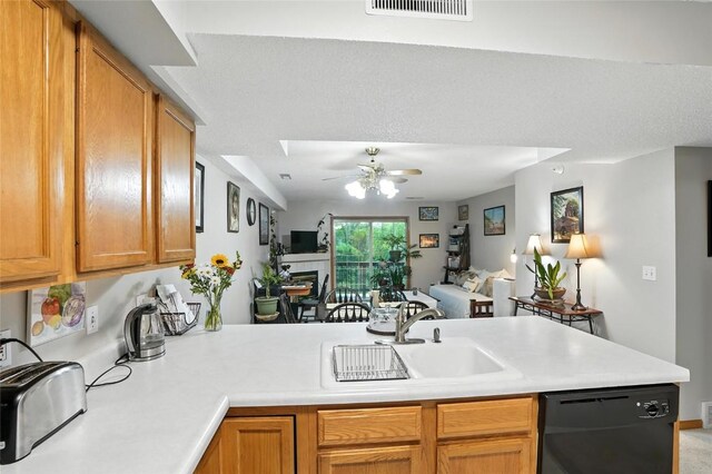 414 W Side Dr, Iowa City, IA 52246 - kitchen with black dishwasher, ceiling fan, a peninsula, light countertops, and open floor plan