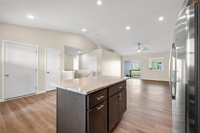 3880 Quail Trail Dr, Marion, IA 52302 - kitchen featuring stainless steel refrigerator, lofted ceiling, a ceiling fan, dark brown cabinets, and light wood-style floors