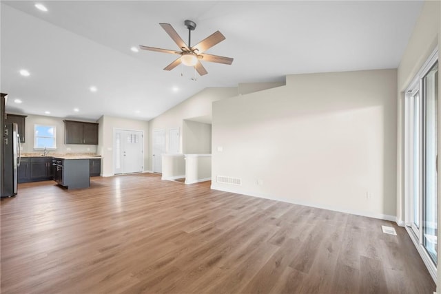 3880 Quail Trail Dr, Marion, IA 52302 - unfurnished living room with lofted ceiling, ceiling fan, light wood-type flooring, and recessed lighting