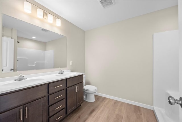 3880 Quail Trail Dr, Marion, IA 52302 - full bath featuring a shower, double vanity, wood finished floors, and a bath