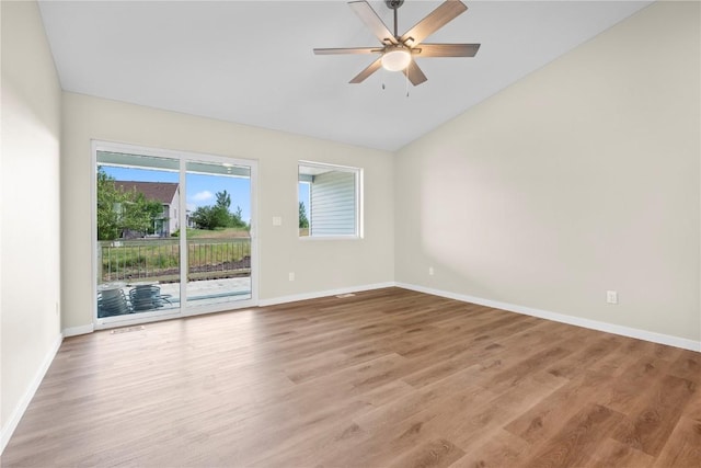 3880 Quail Trail Dr, Marion, IA 52302 - spare room featuring lofted ceiling, light wood-style flooring, and ceiling fan