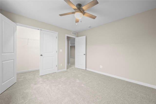 3880 Quail Trail Dr, Marion, IA 52302 - unfurnished bedroom with light carpet, a closet, and ceiling fan