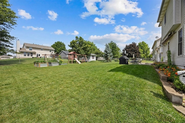 1720 Charleston Dr, Marion, IA 52302 - view of yard featuring a playground and a garden