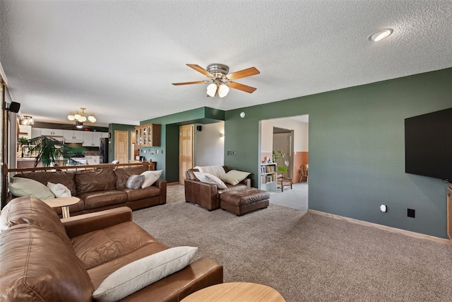 1720 Charleston Dr, Marion, IA 52302 - living room featuring carpet floors, ceiling fan, and a textured ceiling