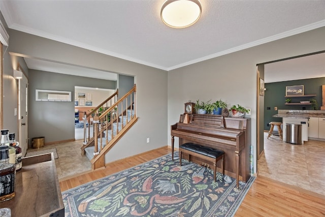 1720 Charleston Dr, Marion, IA 52302 - foyer with crown molding, wood finished floors, and stairway