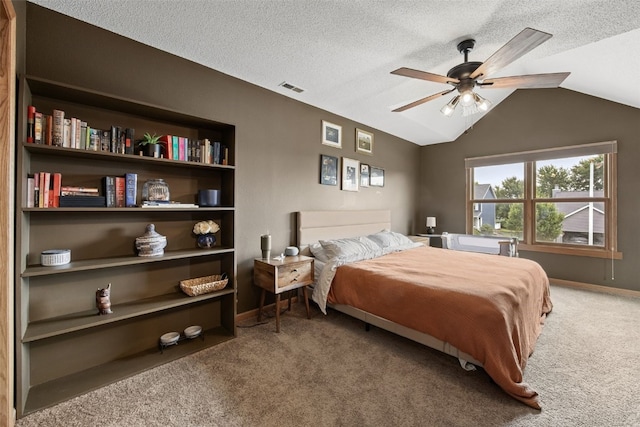 1720 Charleston Dr, Marion, IA 52302 - bedroom with carpet, vaulted ceiling, ceiling fan, and a textured ceiling