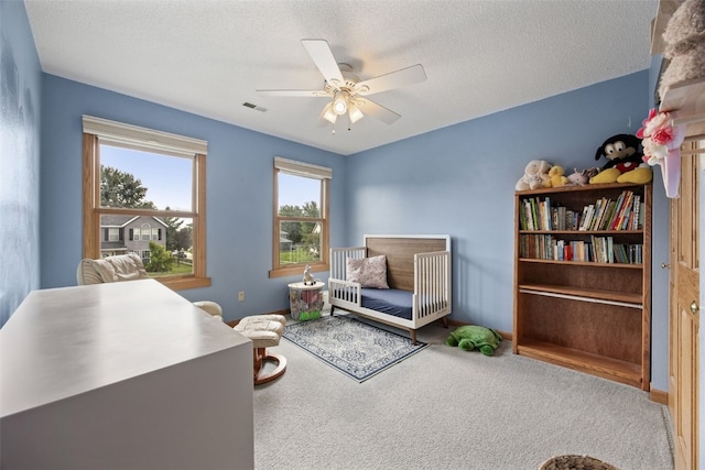 1720 Charleston Dr, Marion, IA 52302 - office with a ceiling fan, carpet flooring, and a textured ceiling