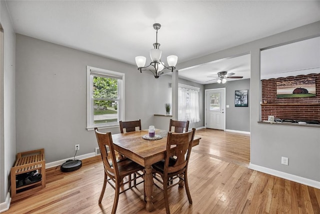 115 3rd St NE, Mount Vernon, IA 52314 - dining space featuring light wood-type flooring, a chandelier, and ceiling fan