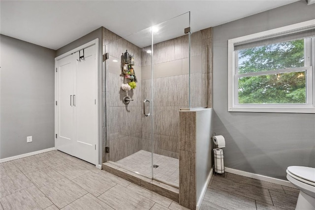 115 3rd St NE, Mount Vernon, IA 52314 - full bathroom featuring baseboards and a shower stall