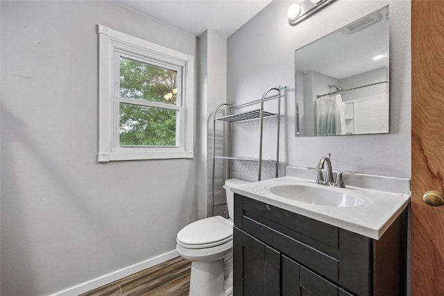 115 3rd St NE, Mount Vernon, IA 52314 - full bathroom with vanity, wood finished floors, and curtained shower