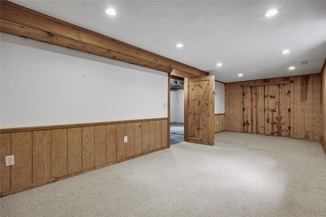 115 3rd St NE, Mount Vernon, IA 52314 - finished basement featuring wood walls, recessed lighting, light colored carpet, and a wainscoted wall