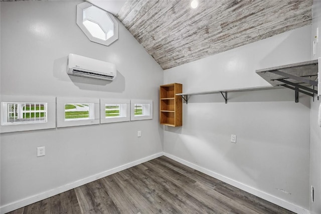 115 3rd St NE, Mount Vernon, IA 52314 - spacious closet with a wall unit AC, vaulted ceiling, and dark wood-style floors
