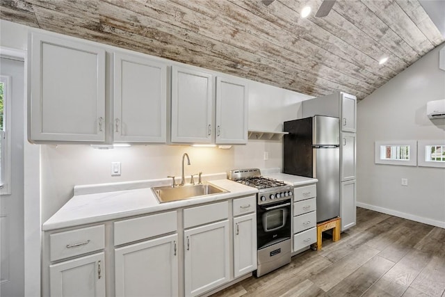 115 3rd St NE, Mount Vernon, IA 52314 - kitchen with stainless steel appliances, wooden ceiling, light wood-type flooring, lofted ceiling, and white cabinetry