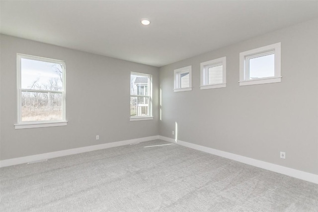 5750 Meadow Grass Cir SE, Cedar Rapids, IA 52403 - carpeted empty room with healthy amount of natural light and recessed lighting