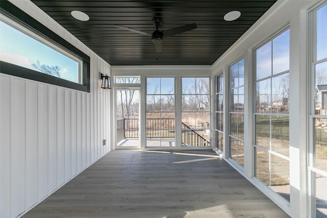 5750 Meadow Grass Cir SE, Cedar Rapids, IA 52403 - unfurnished sunroom featuring a ceiling fan
