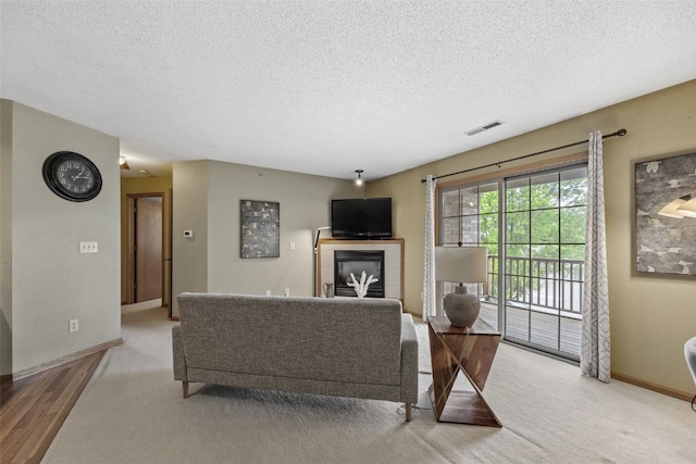 2861 Coral Ct Unit 302, Coralville, IA 52241 - living room with a textured ceiling and light carpet