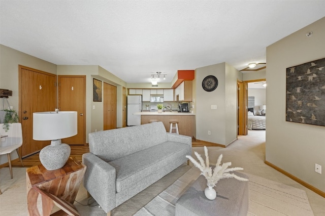2861 Coral Ct Unit 302, Coralville, IA 52241 - living room with baseboards and light carpet