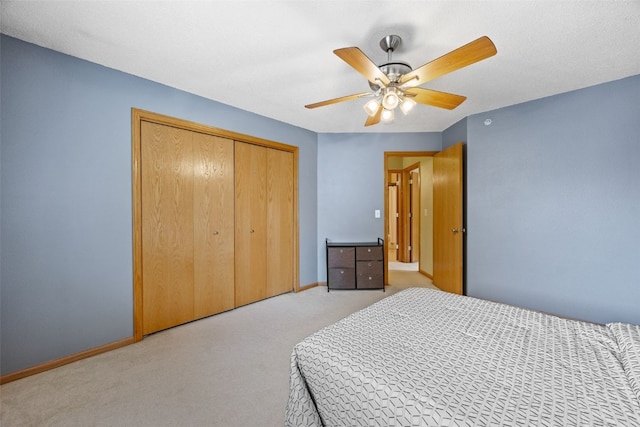2861 Coral Ct Unit 302, Coralville, IA 52241 - bedroom featuring light carpet, a closet, and ceiling fan