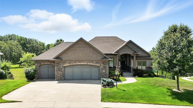 701 Sherwood Dr, Iowa City, IA 52245 - view of front of home with a garage, driveway, stone siding, and a front lawn
