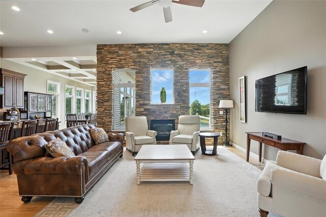 701 Sherwood Dr, Iowa City, IA 52245 - living area featuring recessed lighting, beamed ceiling, ceiling fan, a fireplace, and coffered ceiling