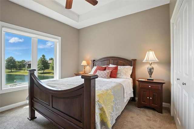701 Sherwood Dr, Iowa City, IA 52245 - bedroom with light colored carpet and a ceiling fan