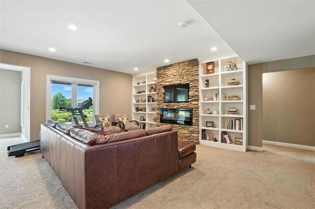 701 Sherwood Dr, Iowa City, IA 52245 - living area featuring light colored carpet, recessed lighting, a fireplace, and built in features