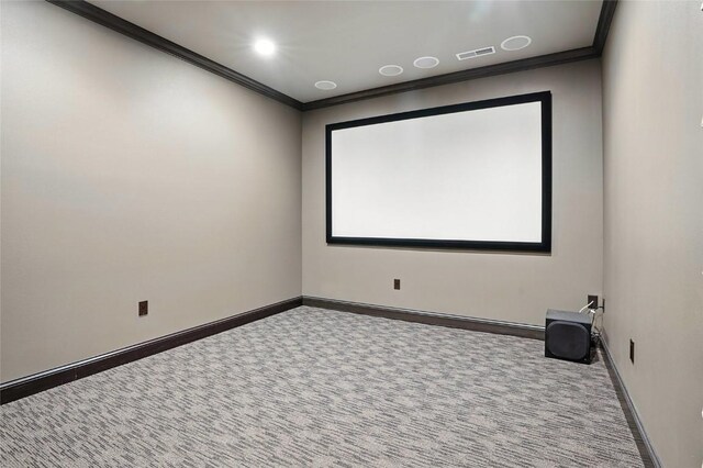 701 Sherwood Dr, Iowa City, IA 52245 - carpeted home theater with crown molding and baseboards