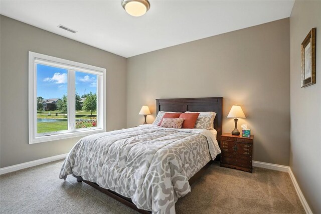 701 Sherwood Dr, Iowa City, IA 52245 - carpeted bedroom featuring baseboards