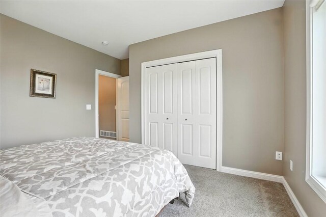 701 Sherwood Dr, Iowa City, IA 52245 - bedroom with carpet flooring and a closet