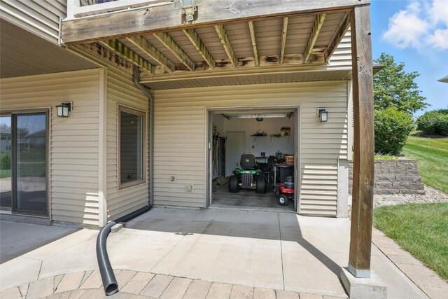 701 Sherwood Dr, Iowa City, IA 52245 - view of patio featuring a garage