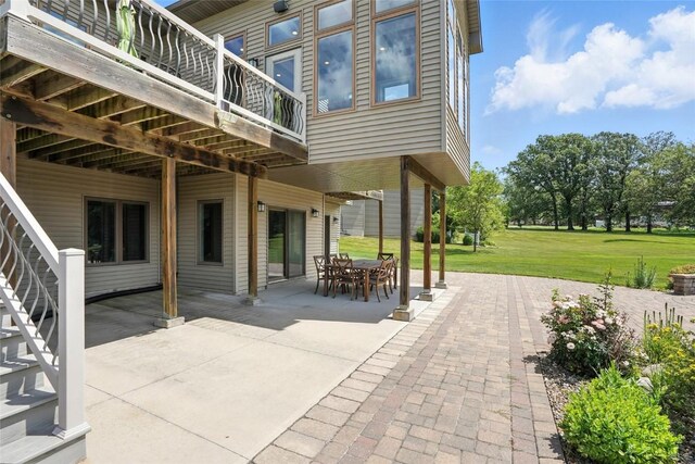 701 Sherwood Dr, Iowa City, IA 52245 - view of patio with a wooden deck and outdoor dining space
