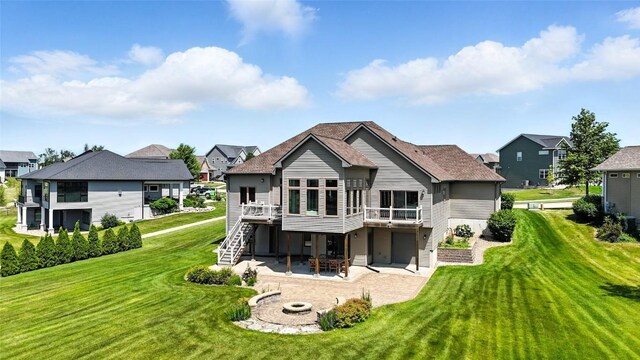 701 Sherwood Dr, Iowa City, IA 52245 - rear view of house with stairs, a patio, an outdoor fire pit, a deck, and a lawn