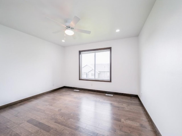 3502 Bluebird Dr SW, Cedar Rapids, IA 52404 - unfurnished room with wood finished floors, a ceiling fan, and recessed lighting
