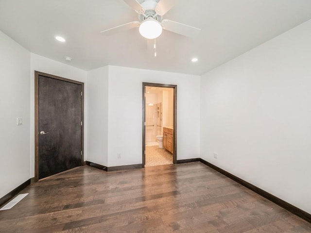 3502 Bluebird Dr SW, Cedar Rapids, IA 52404 - unfurnished bedroom with wood finished floors, recessed lighting, connected bathroom, and a ceiling fan