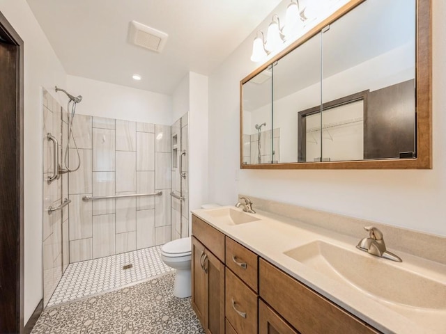 3502 Bluebird Dr SW, Cedar Rapids, IA 52404 - bathroom featuring a tile shower and double vanity