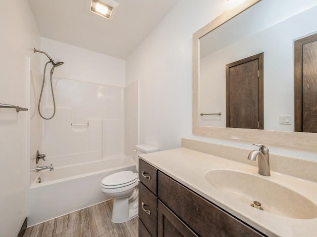 3502 Bluebird Dr SW, Cedar Rapids, IA 52404 - full bath featuring wood finished floors, vanity, and washtub / shower combination