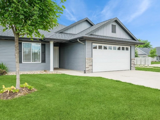 3502 Bluebird Dr SW, Cedar Rapids, IA 52404 - view of front facade featuring board and batten siding, an attached garage, a front lawn, driveway, and roof with shingles