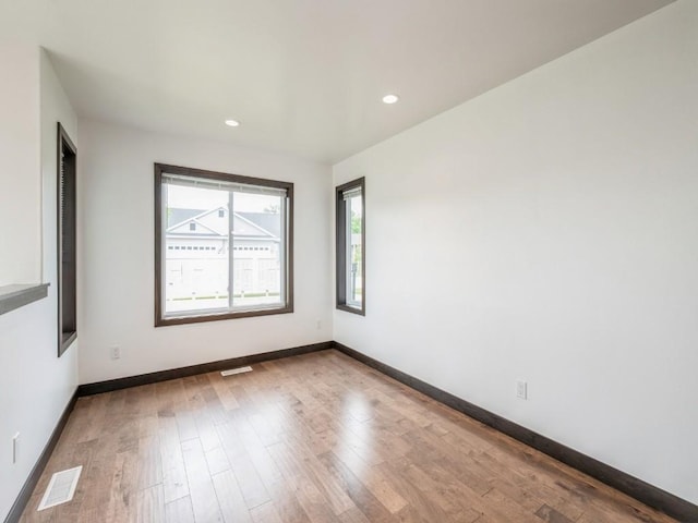 3502 Bluebird Dr SW, Cedar Rapids, IA 52404 - spare room featuring wood finished floors and recessed lighting