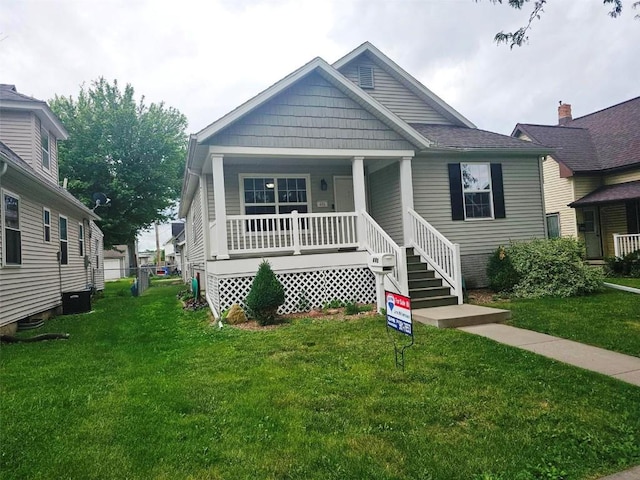 441 8th Ave SW, Cedar Rapids, IA 52404 - view of front of property featuring covered porch and a front yard