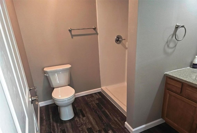 441 8th Ave SW, Cedar Rapids, IA 52404 - bathroom with a shower stall, wood finished floors, and vanity