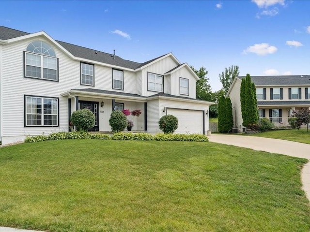 725 High Point Dr SW, Cedar Rapids, IA 52404 - view of front of home featuring driveway, a front yard, board and batten siding, and a garage