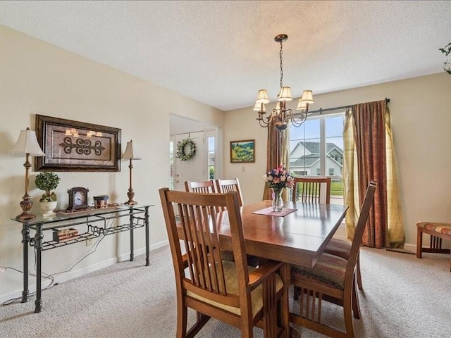 725 High Point Dr SW, Cedar Rapids, IA 52404 - carpeted dining area with a chandelier and a textured ceiling