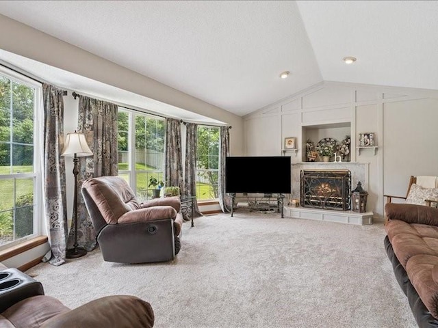 725 High Point Dr SW, Cedar Rapids, IA 52404 - carpeted living room with lofted ceiling and a lit fireplace
