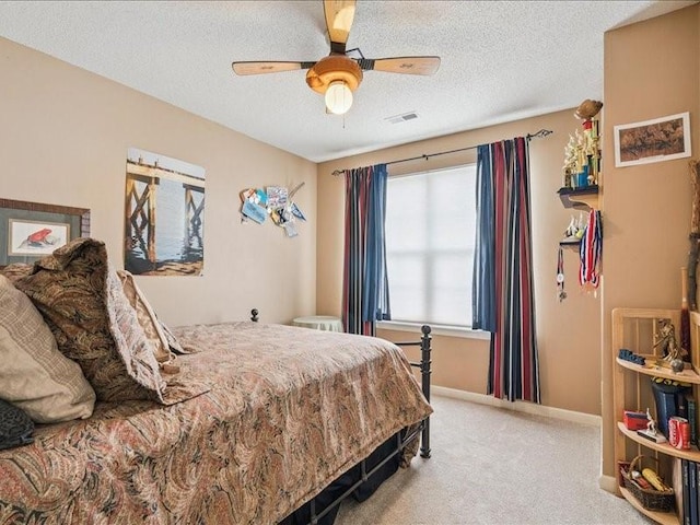 725 High Point Dr SW, Cedar Rapids, IA 52404 - bedroom featuring light colored carpet, a textured ceiling, and ceiling fan
