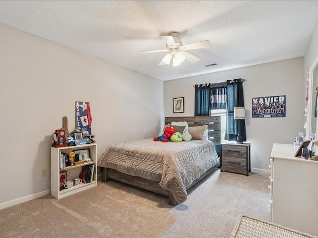 725 High Point Dr SW, Cedar Rapids, IA 52404 - bedroom with carpet floors, ceiling fan, and a textured ceiling
