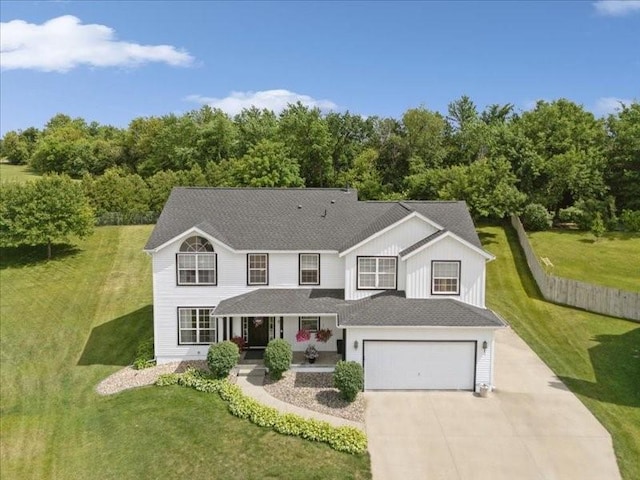 725 High Point Dr SW, Cedar Rapids, IA 52404 - view of front of house with covered porch, driveway, board and batten siding, a front yard, and a garage