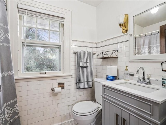206 Kingbard Blvd, Waterloo, IA 50701 - full bathroom featuring tile walls and vanity