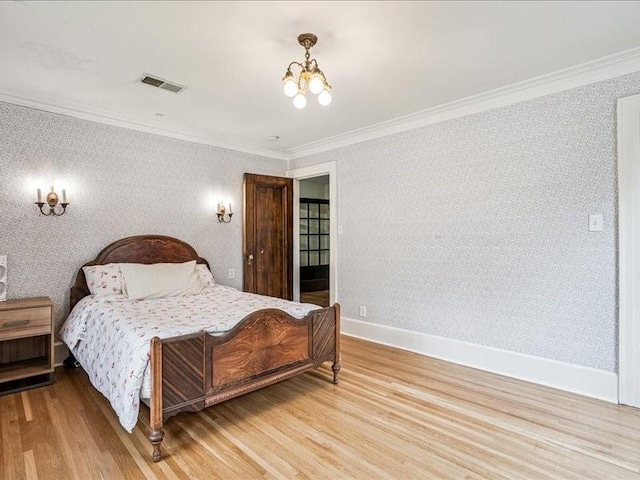 206 Kingbard Blvd, Waterloo, IA 50701 - bedroom with crown molding, a chandelier, light wood-style flooring, and wallpapered walls