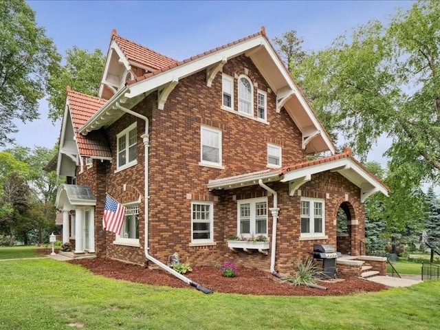 206 Kingbard Blvd, Waterloo, IA 50701 - view of side of home with a lawn and brick siding